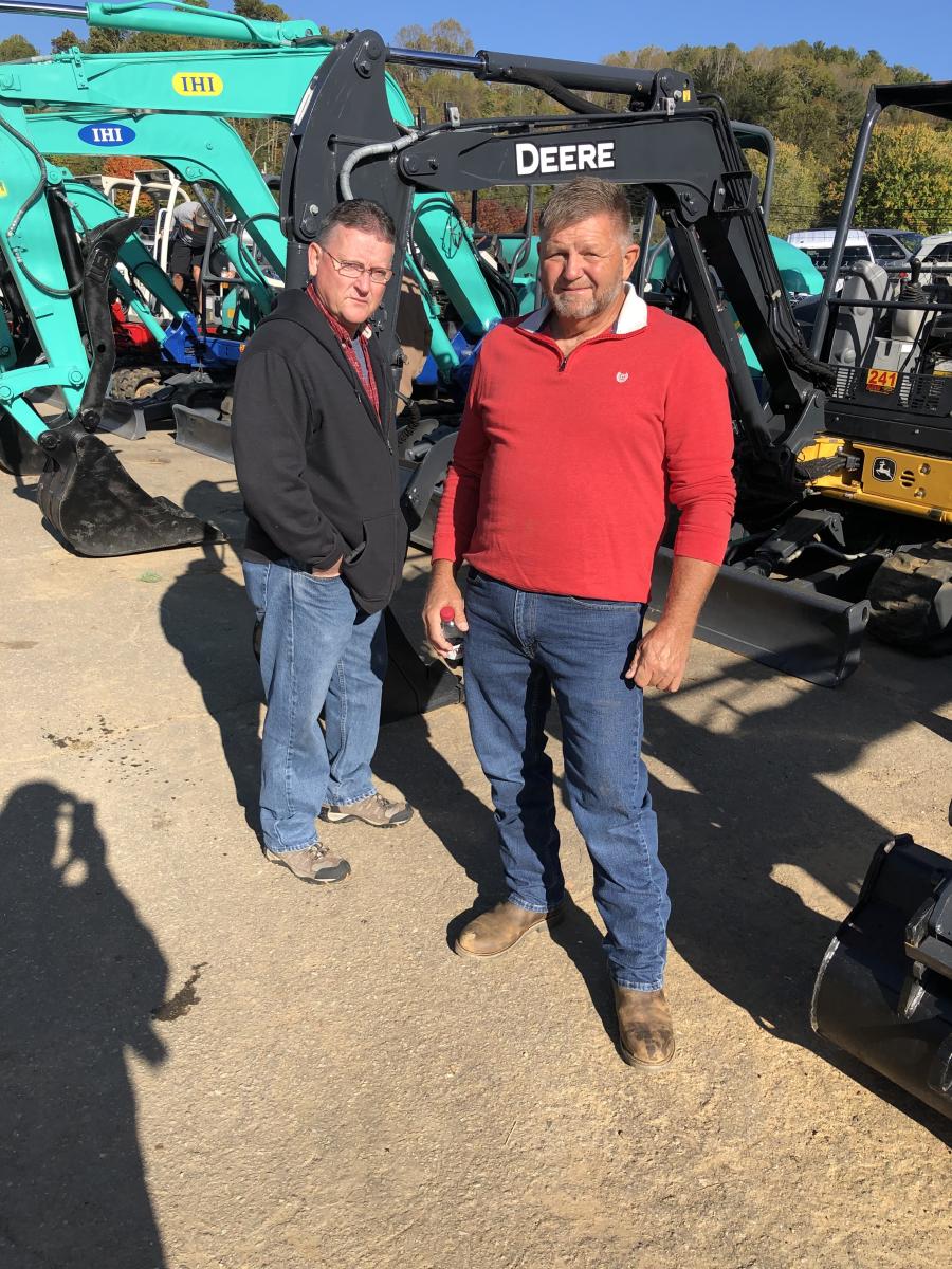 The good selection of compact excavators caught the attention of Tim McKinney (L) and James Guinn, both of Guinn Logging in Newland, N.C.