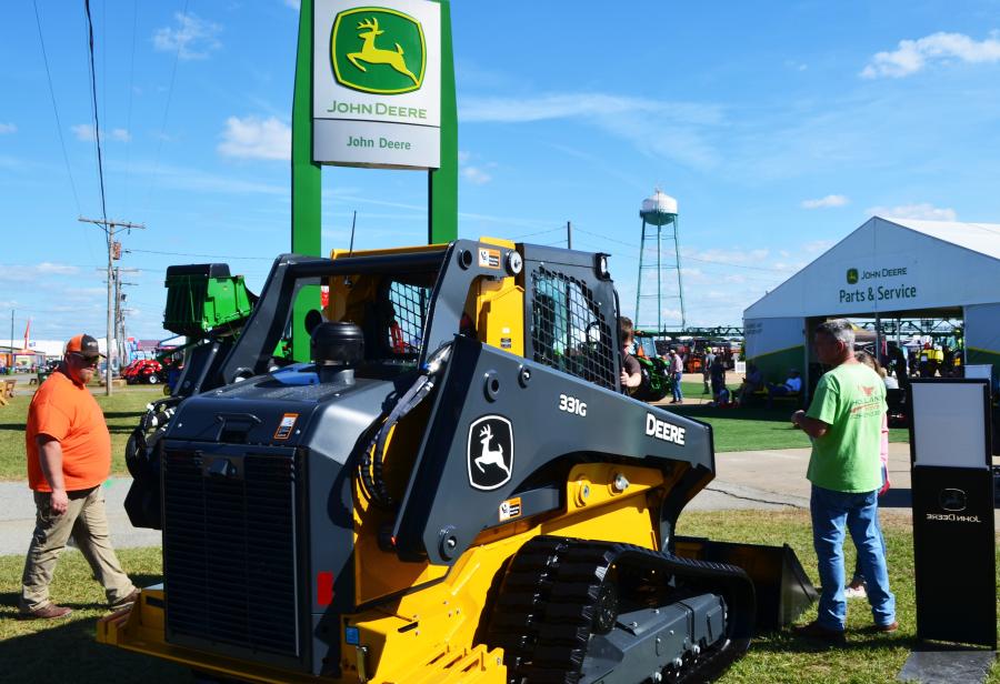 Meshing the green with the yellow machines at the John Deere “small tent city” draws thousands to their exhibit area.