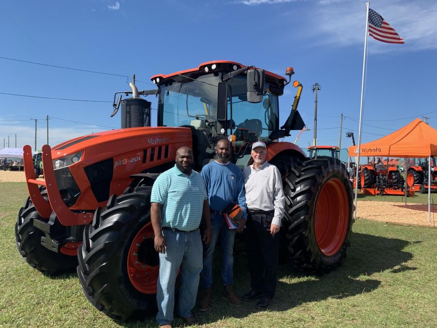 U.S. Marine Corps veteran Tracy Robinson (c), who farms in Blakely, Ga., received a one-year lease of a Kubota M8 Series tractor during a special ceremony at the Sunbelt Ag Expo in Moultrie, Ga.
