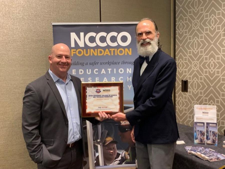 Cory Albano, COO, Heavy Equipment Colleges of America (L) and Graham Brent, CEO, NCCCO Foundation announce the VICTOR award program at the Sixth Annual Industry Forum on Personnel Qualifications Nov. 11, 2021, in Arlington, Va.