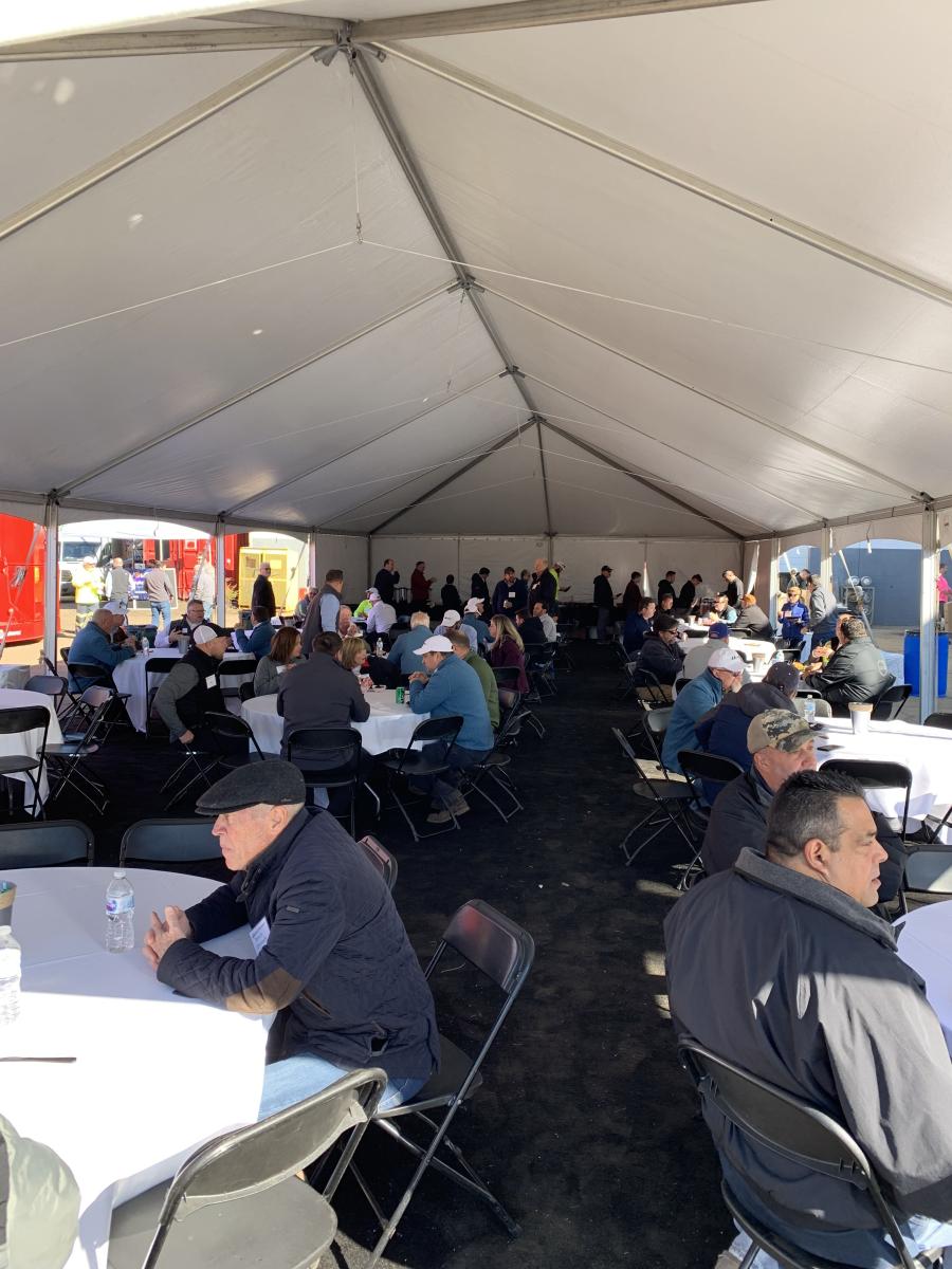 Guests enjoyed a BBQ lunch inside a tent at the Hoffman Equipment open house.