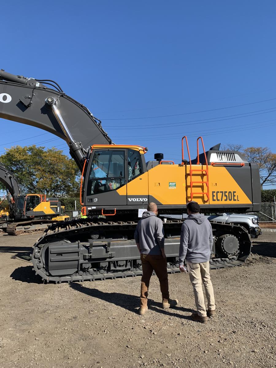Representatives of Nordic Contracting, Kenville, N.J., took time to check out the specs on the Volvo EC750E excavator.