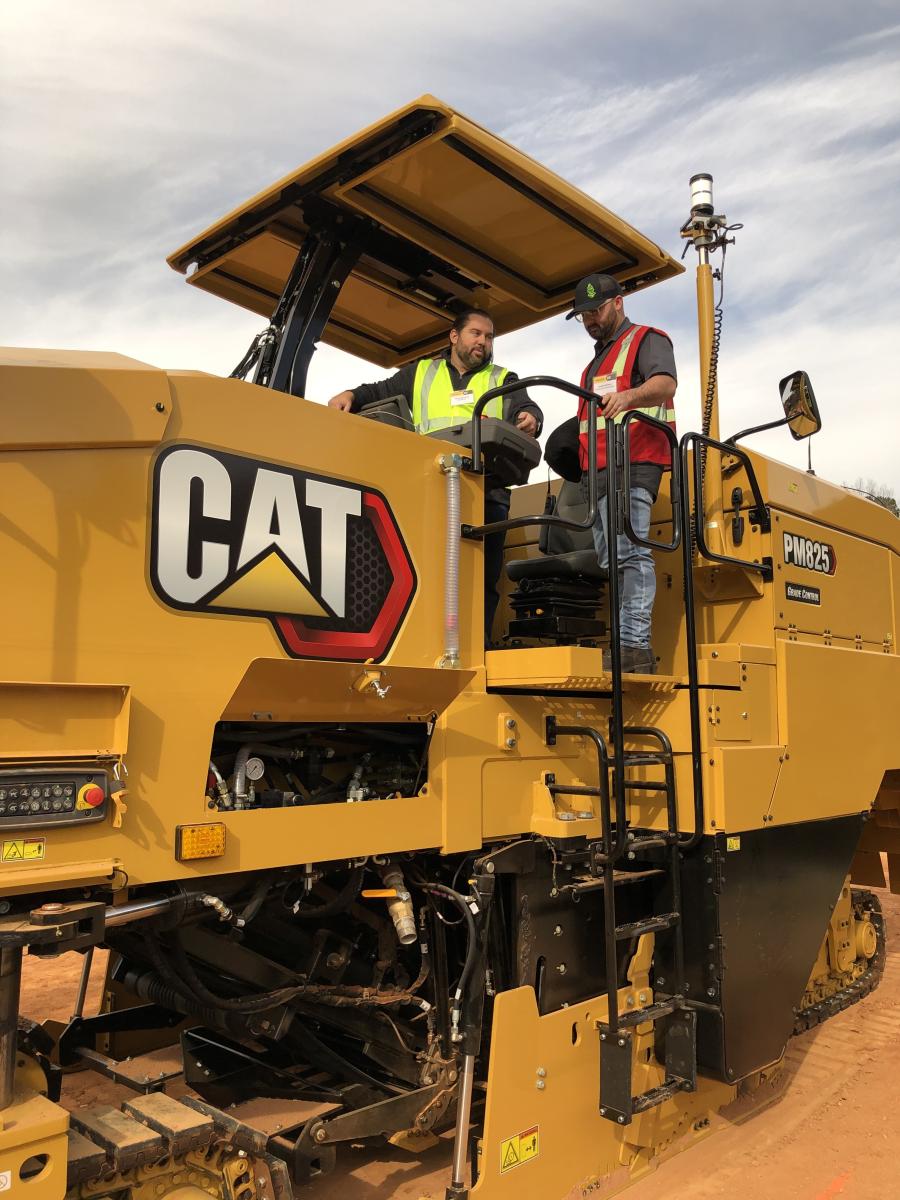 Travis McClung (L) of Caterpillar goes over the PM825’s ease of operation with Joe Neilso of B. Jackson Construction in West Jordan, Utah.