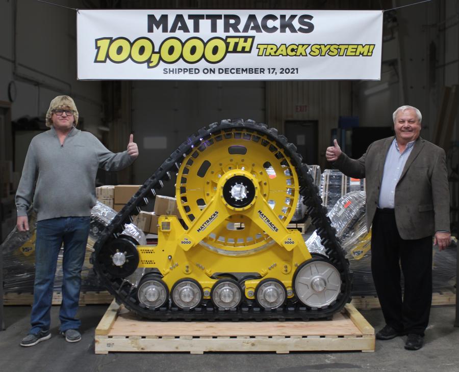 Mattracks Special Operations Coordinator and Original Concept Creator Matt Brazier (L) and Mattracks Founder & CEO Glen Brazier stand next to the company’s 100,000th shipped out track system on Dec. 17, 2021.