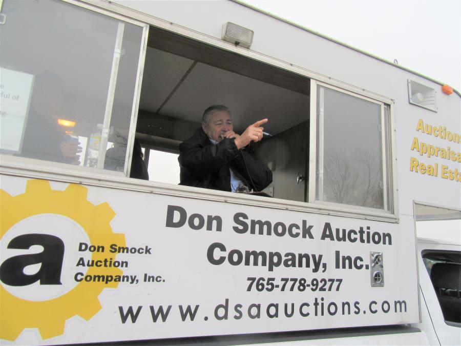 Don Smock Auction Company auctioneer Kenny Jackson calls out the bids in the equipment yard.
