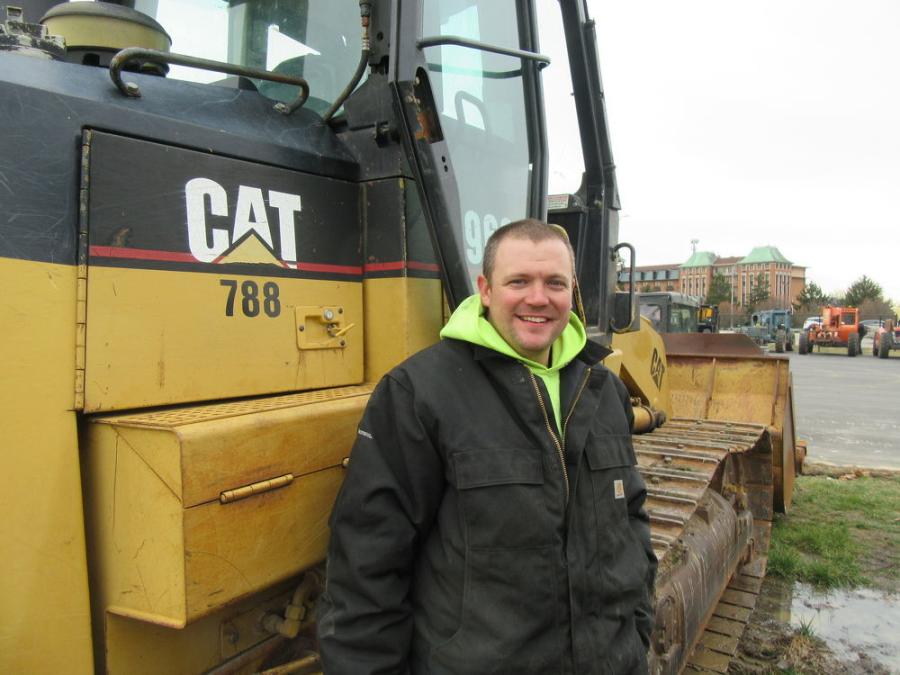 Falco Drilling’s Steven Tate looks over this Cat 963C crawler loader after landing some deals.
