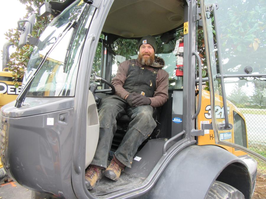 Mike Blankenship of Blankenship Tree Service found a spot to stay warm in this Case 321F backhoe.
