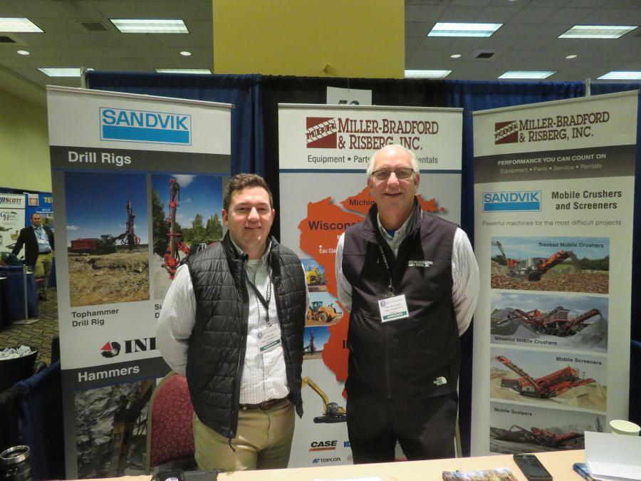 Jeff DeLong (L) and Dave Bawinkel of Miller-Bradford and Risberg set up a display on the company’s Sandvik equipment.

