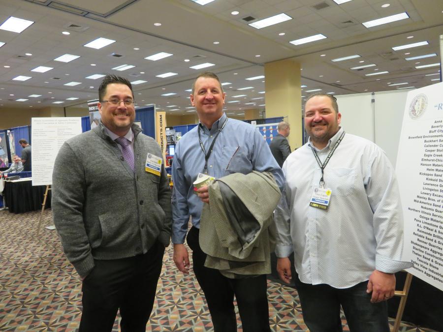(L-R): Josh Quinn of Bluff City Materials; Jeff Radack of Ozinga Materials; and Vince Caputo of Ozinga Materials gathered information on the latest equipment available. 
