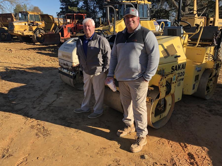 Doc McGee (L) of McGee Brothers Inc. in Monroe, N.C., and Shane Ferguson, Cardinal Concrete in Midland, N.C., were looking at the equipment up for bid.
