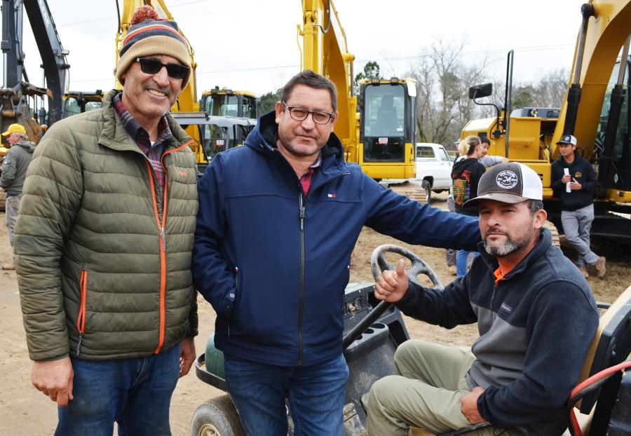 (L-R): Mo Safawi, SMG Trading, Newnan, Ga; Ibrahim Saleh, S&Z Import & Export, Dallas, Ga; and Victor Bautista, of Joey Martin Auctioneers, enjoy the auction life.