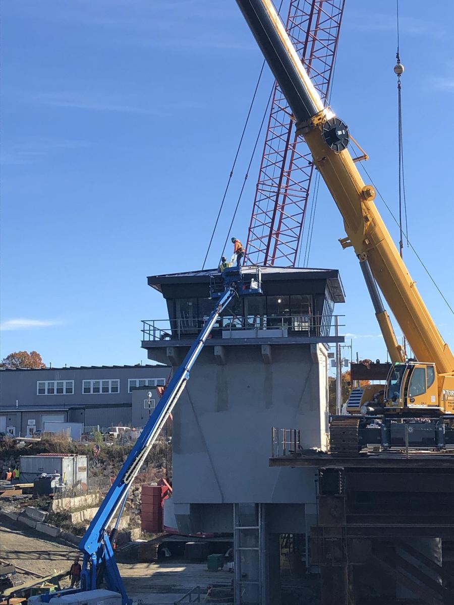 Roof panel being installed on the observation level of the control tower. (MBTA photo)