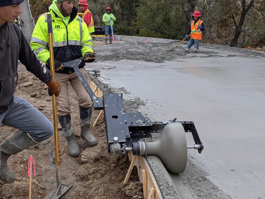 Curb Roller Manufacturing’s Badger Curb Maker shapes and finishes curbs after another product screeds flatwork like streets and parking lots to support user efficiency and reduces the need for additional pours, transportation and labor.