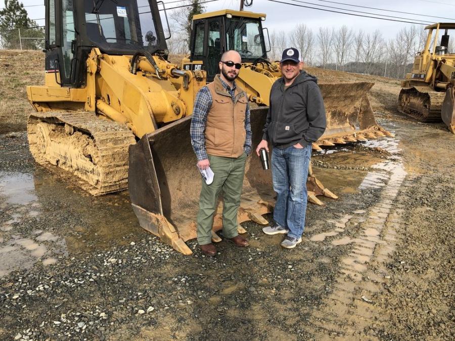 Jesse King (L) of Conerv Capital in Charlotte and Brad Bennett of Novem Industries, also in Charlotte, were looking over the Cat 953C crawler loaders.