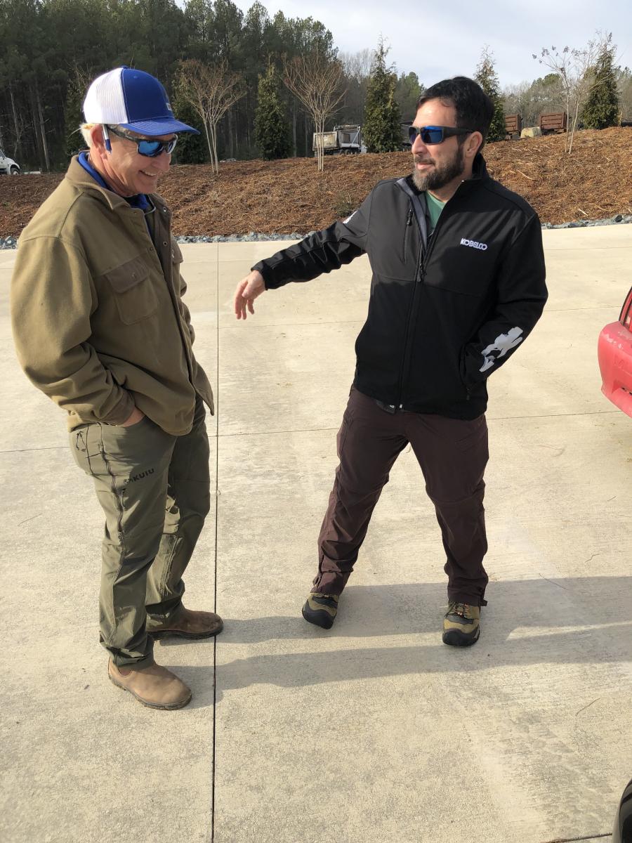 Ross McMillan (L) of Iron Auction Group and Trey Meekins of Sound Heavy Machinery in Charlotte share a few laughs prior to the auction.

