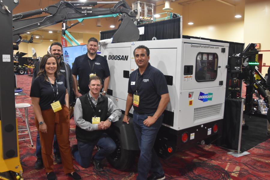 Representing Volvo Construction Equipment and Services (L-R) are Cheyenne Linich, Phil Ransom, Chris Raulinito and Ed Galindo, demonstrating a comprehensive mobile generator line up from Doosan Portable Power. Darrin Martin (kneeling) represents Doosan. 