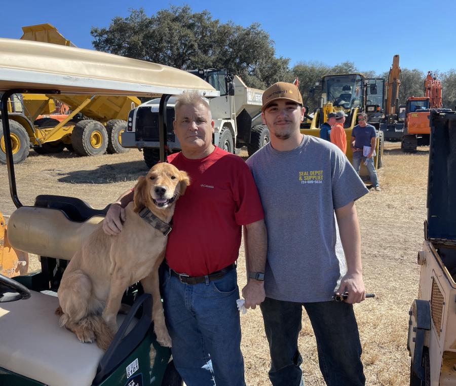 (L-R): CJ helps his owners, Greg and Christian Weaver of Seal Depot and Supplies in Irwin, Pa., look for paving equipment to purchase.