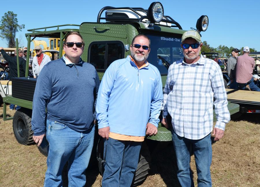 A rather unique piece — an 8-wheeler Mudd-Ox amphibious vehicle — was purchased by the guys from Bottom Line Equipment based in Louisiana. (L-R) are Hunter Patin, Leonard St. Germain and Kurt Degueyter.