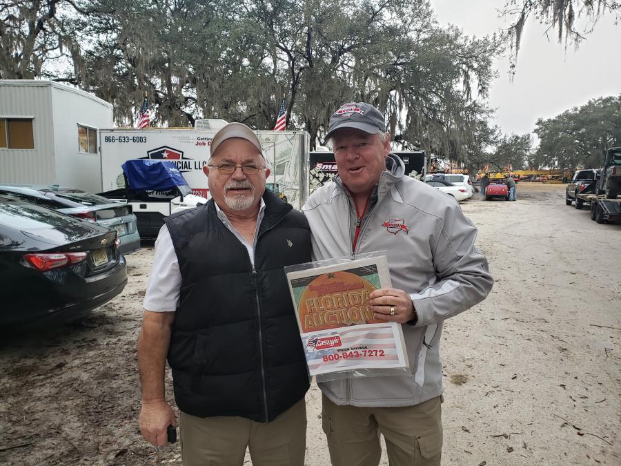 Jack Lyon (L), president of Alex Lyon & Son, and Steve Coon, president of Coon Restoration in Louisville, Ohio, made sure to check out Construction Equipment Guide’s Florida Auctions special edition.