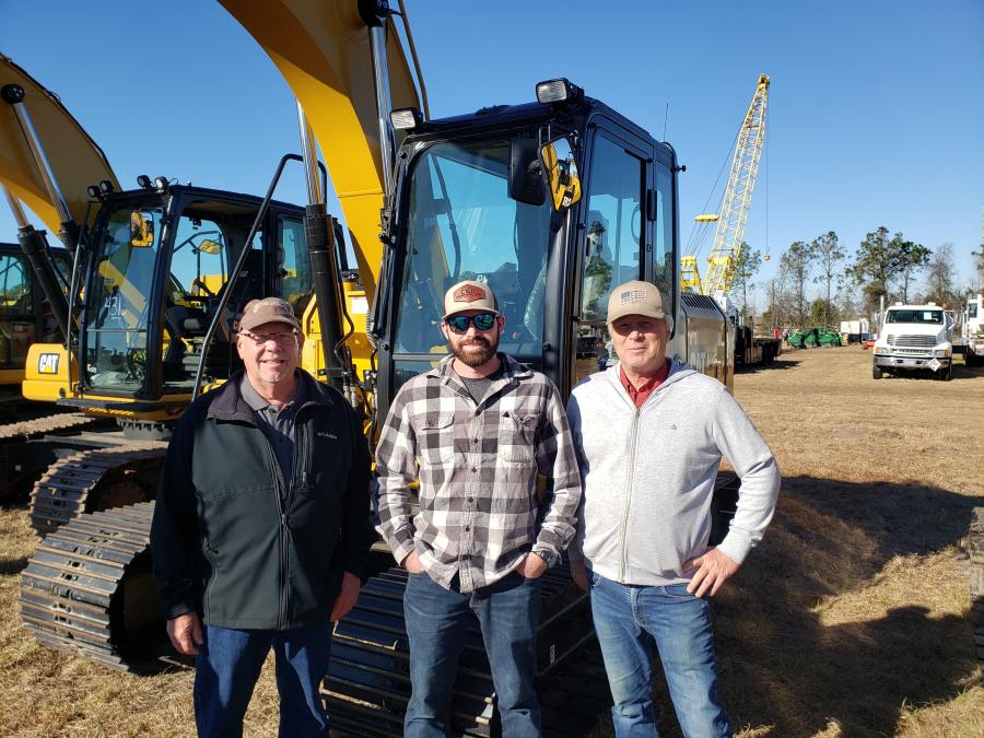 The Rasmussen Rents crew of Binghamton, N.Y., had an eye on this Cat 313 F L GC excavator. (L-R) are John Little, Adam Duell and Dave Rasmussen, president.