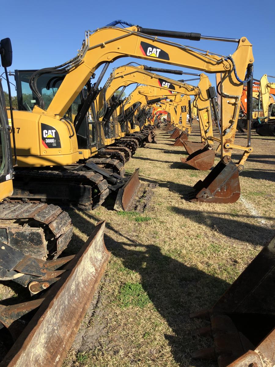 Small excavators are lined up and ready to find new owners.