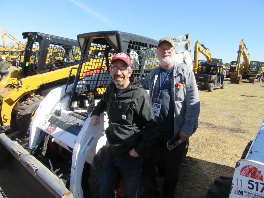 Jimmy Gerow (L) of Clinton Transfer Station and Larry Hunter of Hunter Farms escaped Maine’s cold weather to take in the auction activities.
