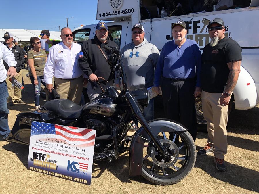 Jeff Martin Auctioneers raised $50,000 to benefit K9s for Warriors by auctioning off this custom-built Harley Davidson. (L-R): Jeff Martin; Robert Foster, retired and K9 recipient of a service dog; top bid and recipient of the motorcycle, Tommy and Eddie Milam of Milam Equipment in Danville, Va.; and the bike builder, Michael Steel of Bottoms Up Chop Shop in Collinsville, Okla.
