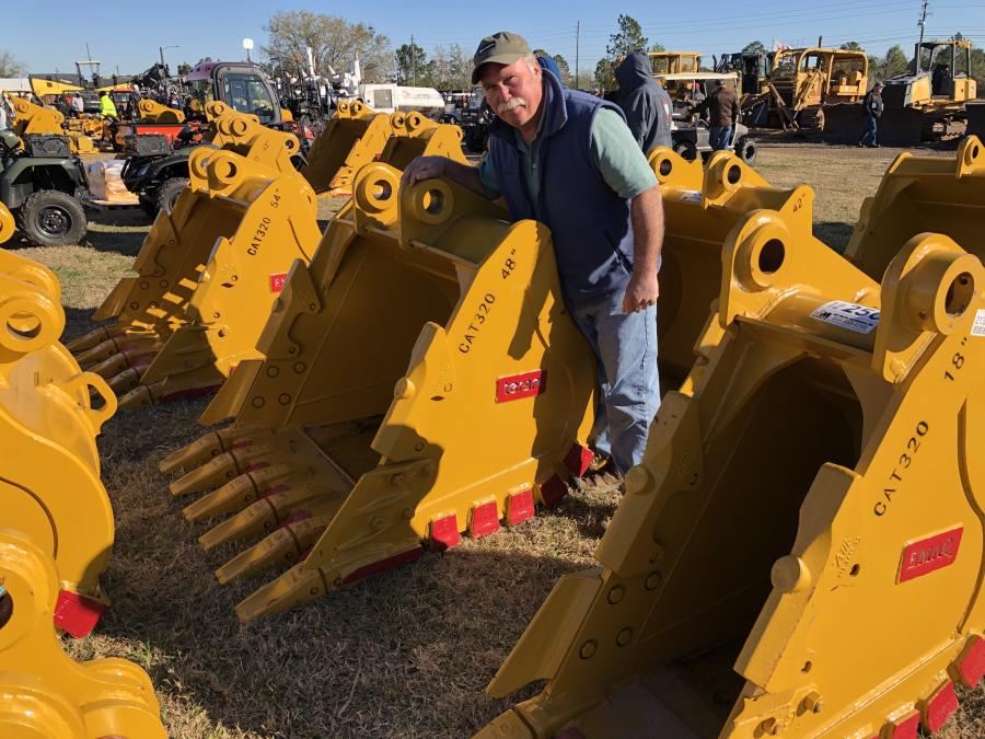 Checking out the many Teran buckets is Cliff Albee of C.A. Construction in Sullivan, Maine.