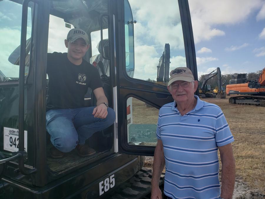 Banks Hoffman (L) and Delbert Hoffman of Hoffman Brothers Lumber in Richfield, Pa., are interested in this Bobcat E85 excavator. 