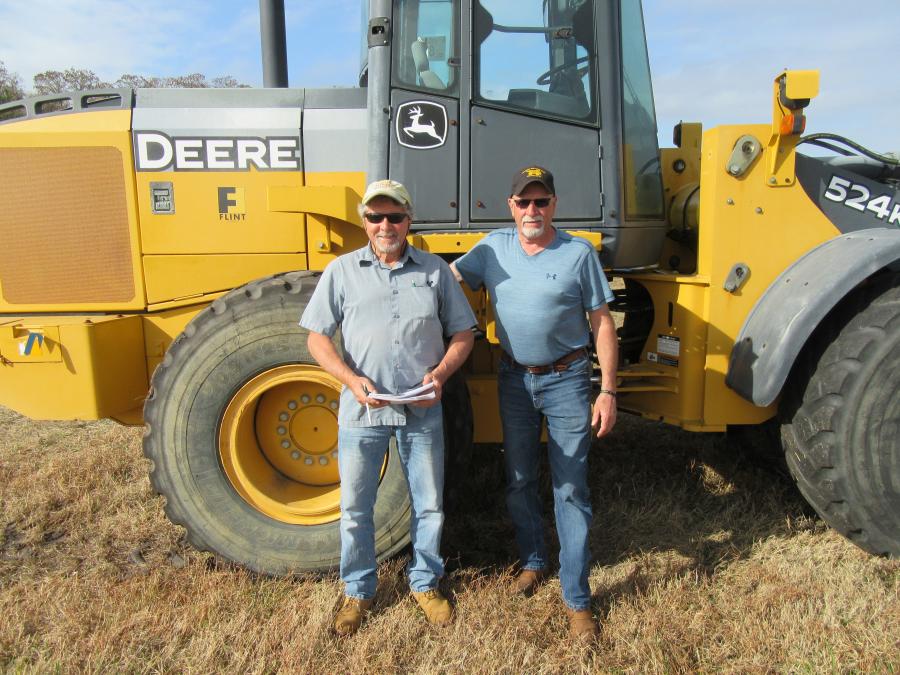 Dan (L) and Roger McHugh of Brookside Equipment Sales hoped to take this John Deere 524K wheel loader back home to Phillipston, Mass., at auction’s end.