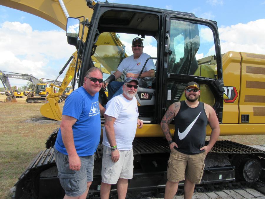 (L-R): Tim and Chad Cole, Scott Smith and Scott Hathaway of Dirt-Tech Company LLC in Colchester, Vt., tried out this Caterpillar 320GC excavator.