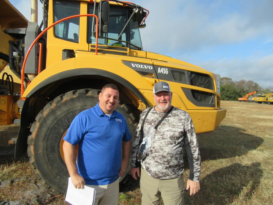 Josh Wright (L) and Jimmy Marston of Kemper Construction, based in Kentucky, consider a bid on this Volvo A45G articulated truck.