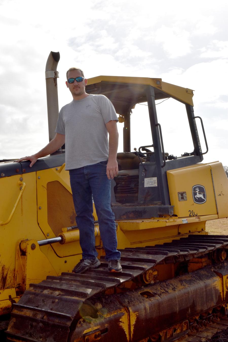 Austin Hawthorn of Mount Dora, Fla., is thinking of diversifying into excavation as he checks out this John Deere 750J dozer. 