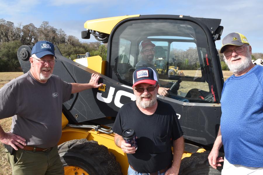 This JCB 260 skid steer may have found a new home in Maine with (L-R) Lloyd Jerow and his son, Wayne, of LD Jerow Construction, along with his good friend Larry Hunter, who owns a hay farm in Maine. In the cab is Jim Bob who is an employee of LD Jerow Construction. 