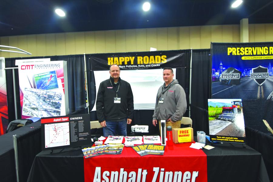 Ken Follett (L), territory manager, and Jason Paas, western states area manager, both of Asphalt Zipper, disucss the cost effective and simple way to repair roads and open utility trenches with their attachments.