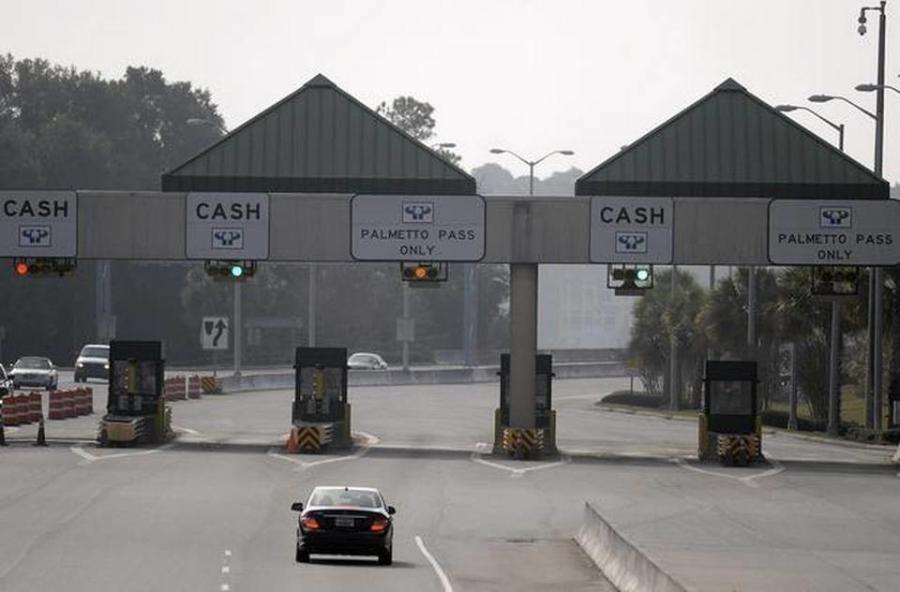 Cars approach the toll facility on Hilton Head Island’s Cross Island Parkway. The tolls were dropped in 2021, and the booths are expected to be removed in 2022. (The Island Packet photo)