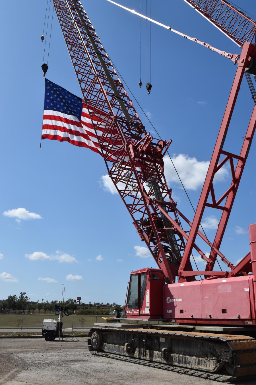 A Manitowoc crane proudly flies Old Glory.