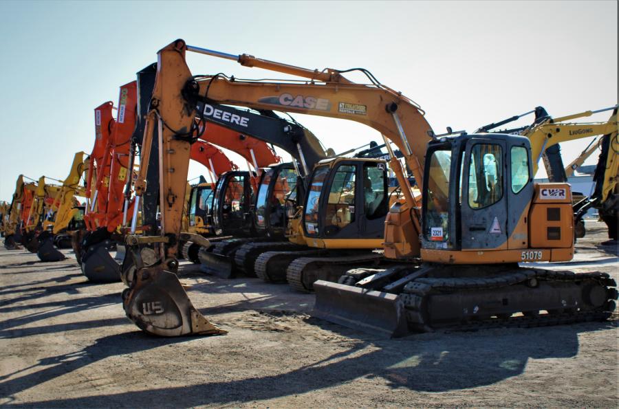 Mid-sized excavators are lined up and ready to go.