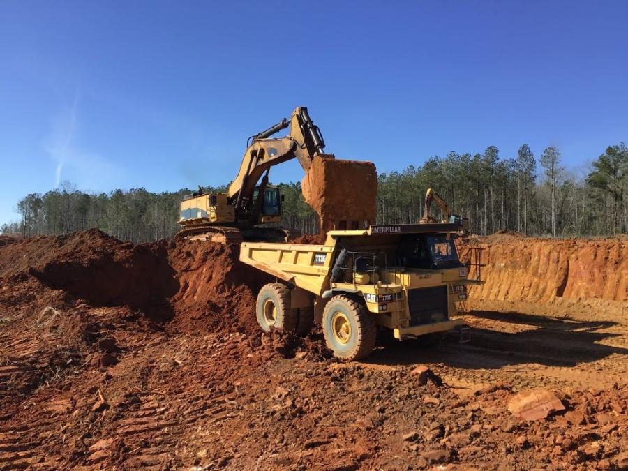 A Cat 390F tracked excavator loads a mass earth moving Cat 773E offroad truck within the work zone for the future Rockingham Bypass.
(NCDOT photo)
