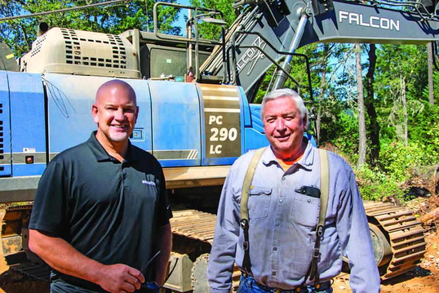 Modern Machinery Territory Manager Ed James (L) and Dancer Logging Inc. Owner Pete Dancer Sr. The Komatsu PC290 excavator that Modern Machinery equipped with a Falcon Winch Assist helps Dancer Logging Inc. perform logging on steep terrain and is used as the “top” or “uphill” machine.