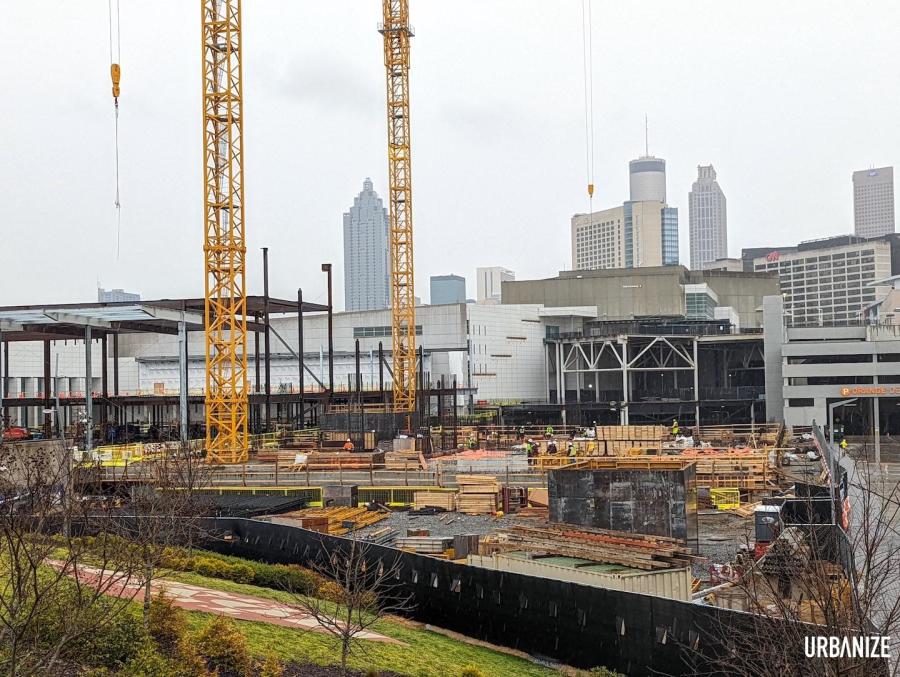 The Georgia World Congress Center Authority’s long-planned major hotel concept is visibly under construction, with two cranes erected over the site off Northside Drive and initial floors coming out of the ground.(Josh Green/Urbanize Atlanta photo)