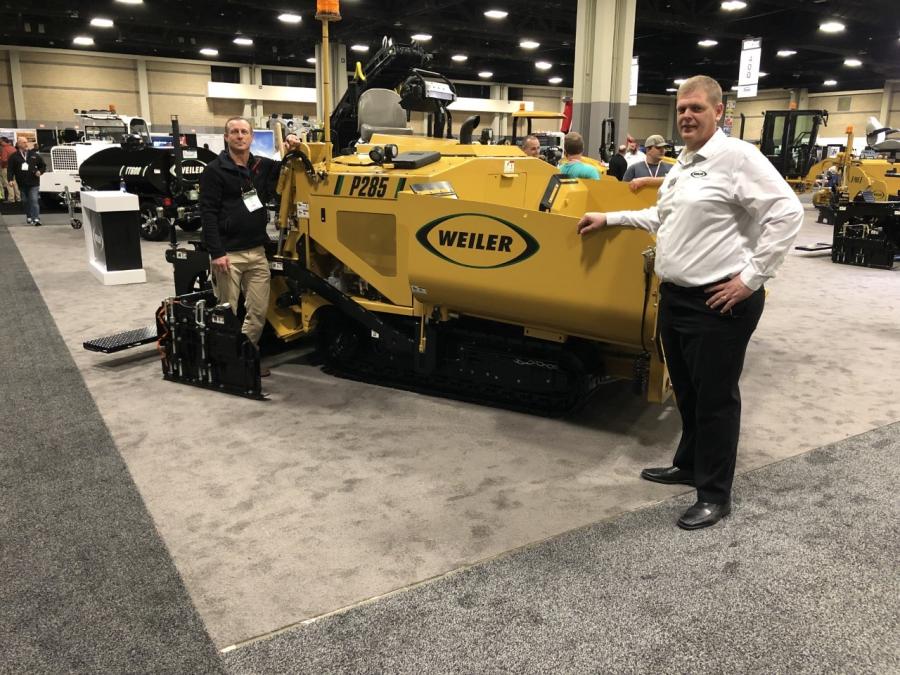 Weiler’s Tim Drost (R) shows Chuck Barnes of Ohio Cat the P285 mid-range paver for driveways, parking lots and other light commercial projects.