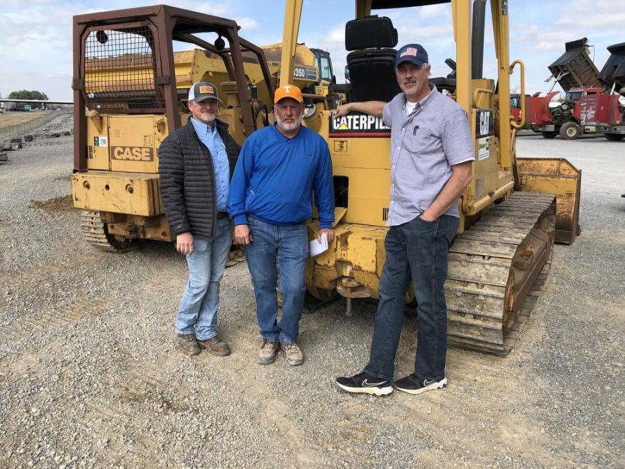 Looking over the selection of dozers (L-R) are Anthony Hall and Ed Wiley, both of Highland Blasting in Kodak, Tenn., and Jonathan Blevins of Blevins Construction in Jamestown, Tenn.