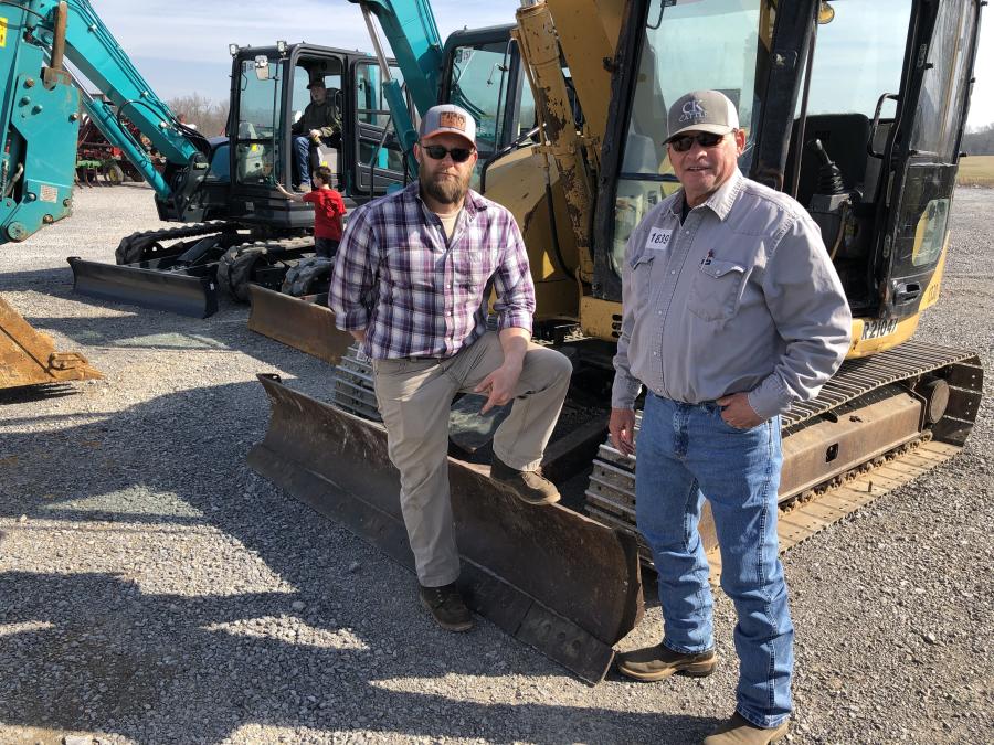 Robert Smith (L) and Bill Foutch, both of Smith Construction in Smith County, Tenn., came to the auction to buy a couple of small excavators.