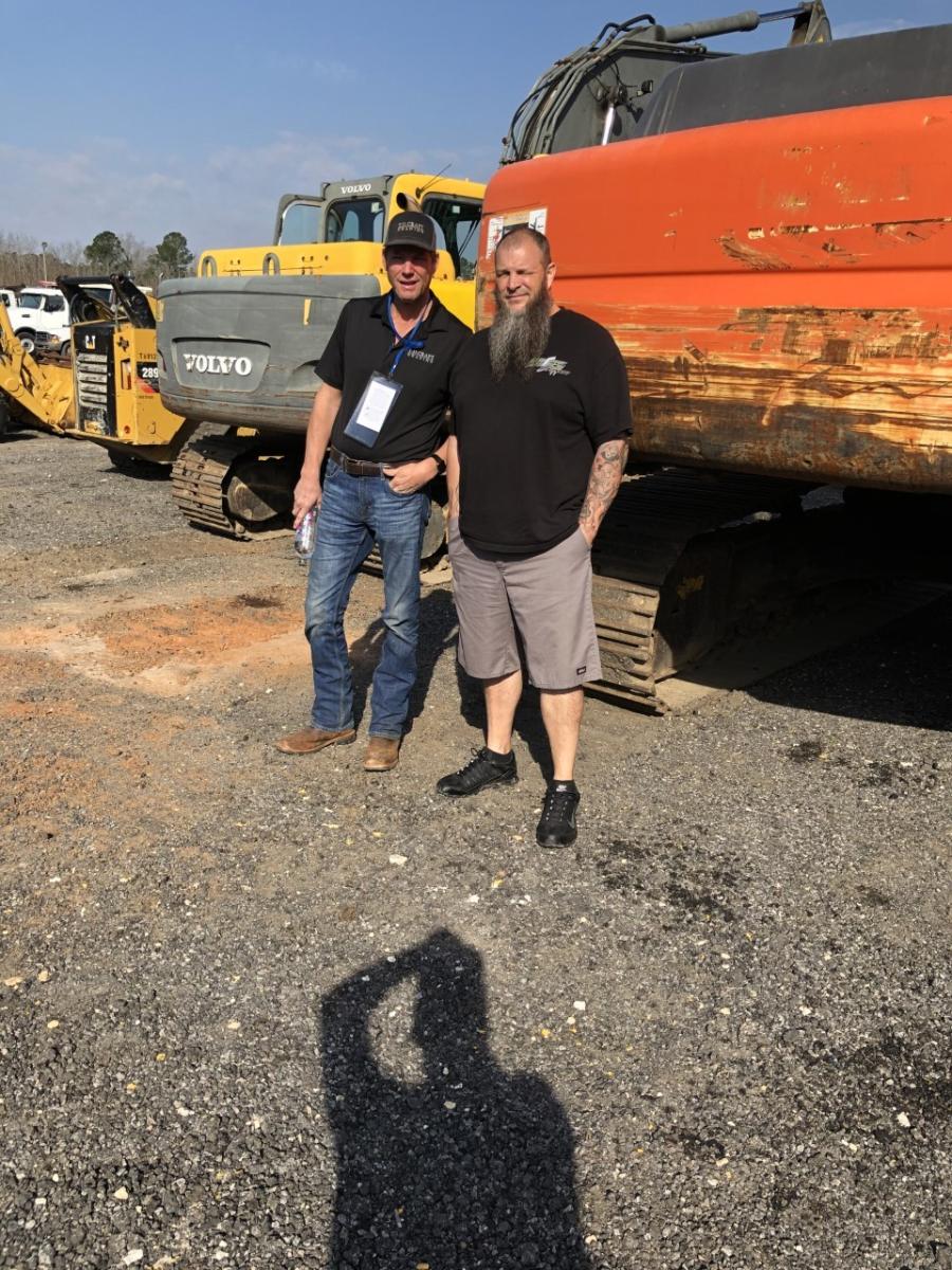 Looking over the excavators are Tom Craft (L), of T.D. Craft Grading in Anderson, S.C., and Travis Yates, of R.L. Yates Trucking in Williamston, S.C.