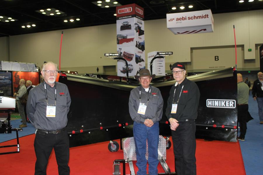 (L-R): Mark Miller, national sales manager of Hiniker in Mankato, Minn., with Reggie Muellereile and Mike Zimprich, also of Hiniker, introduce the Hiniker 9300 series Torsion-Trip V-Plow. The new plow offers versatility with its deep-curled, flared wings that cast deep snow farther and higher, while providing more scoop capacity.
