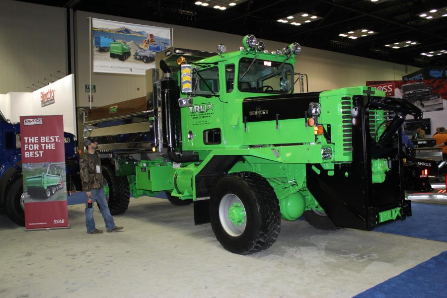 This fully restored Oshkosh airport plow truck with Bibeau Hardox stainless steel body at the Bibeau of Quebec, Canada, booth, is admired by Dustin Tanner of Knapheide Equipment in Quincy, Ill. “They did an absolutely perfect job restoring this truck, it looks like it could go to work today and move some snow,“ said Tanner.