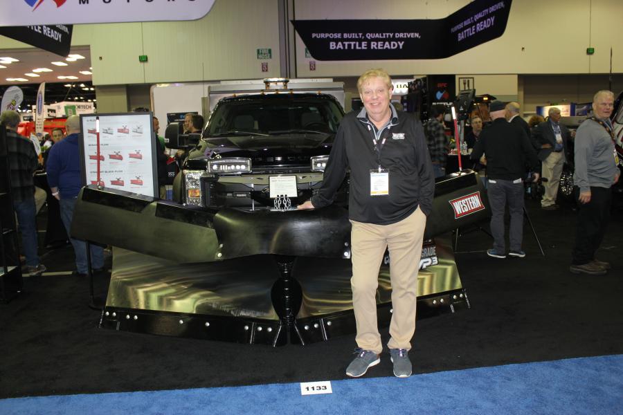 Industry legend Dave Forsmark, product specialist of Western Products, Milwaukee, Wis., with the company’s MVP heavy-duty plow.