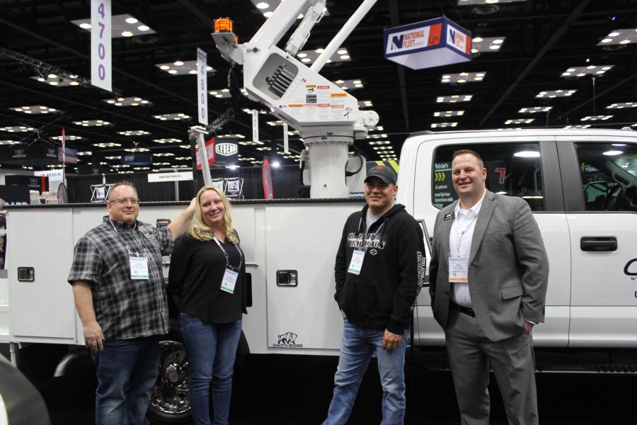 Dakota Bodies of Watertown, S.D., had one of its biggest dealers stop by its booth. (L-R) are Patrick Iwan, owner and president of Iron Valley Truck Equipment in St. Cloud, Minn.; Adele Perkins and Chad Myrvold, both of Iron Valley; and Brad Cordell, dealer representative of Dakota Bodies. 