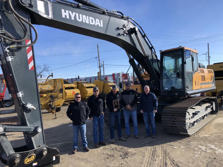 The West River Equipment management and sales team accepts the Hyundai dealer plaque. (L-R) are Chase Chiles, sales associate; Lyle Boehm, co-owner; Delvin Boehm, co-owner; Mark Brosh, sales associate; and Ed Harseim, North Central sales manager of Hyundai Construction Equipment Americas .